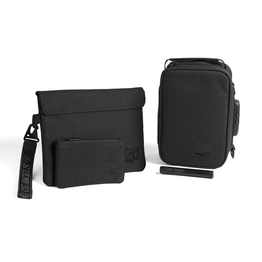 Set of black Coast Angels travel bags with a visible brand logo on a white background